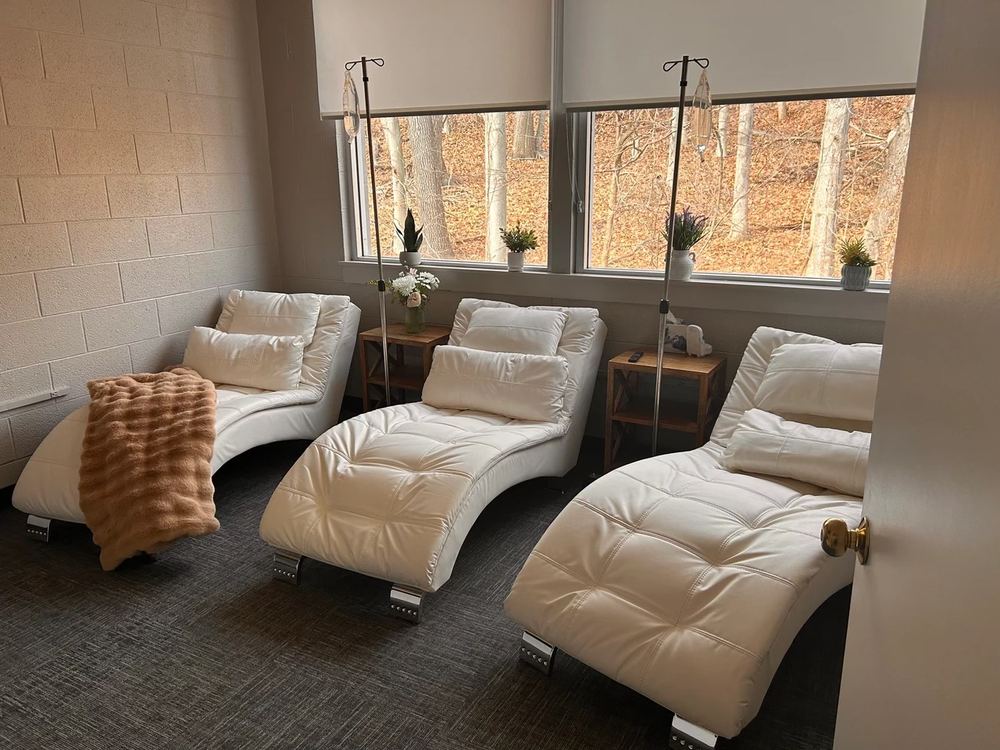 IV therapy lounge CT Medical Weight Loss Glastonbury CT . patient relaxing in comfortable chair during infusion session